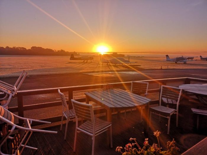Sunrise over the apron at Redhill as viewed from the Pilot's Hub, perfect for enthusiasts!