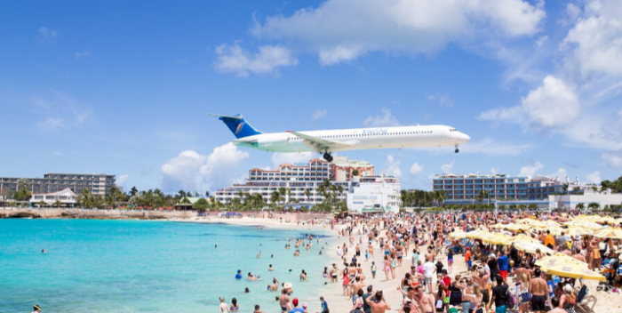 Go to St Maarten to witness the planes flying in over the beach
